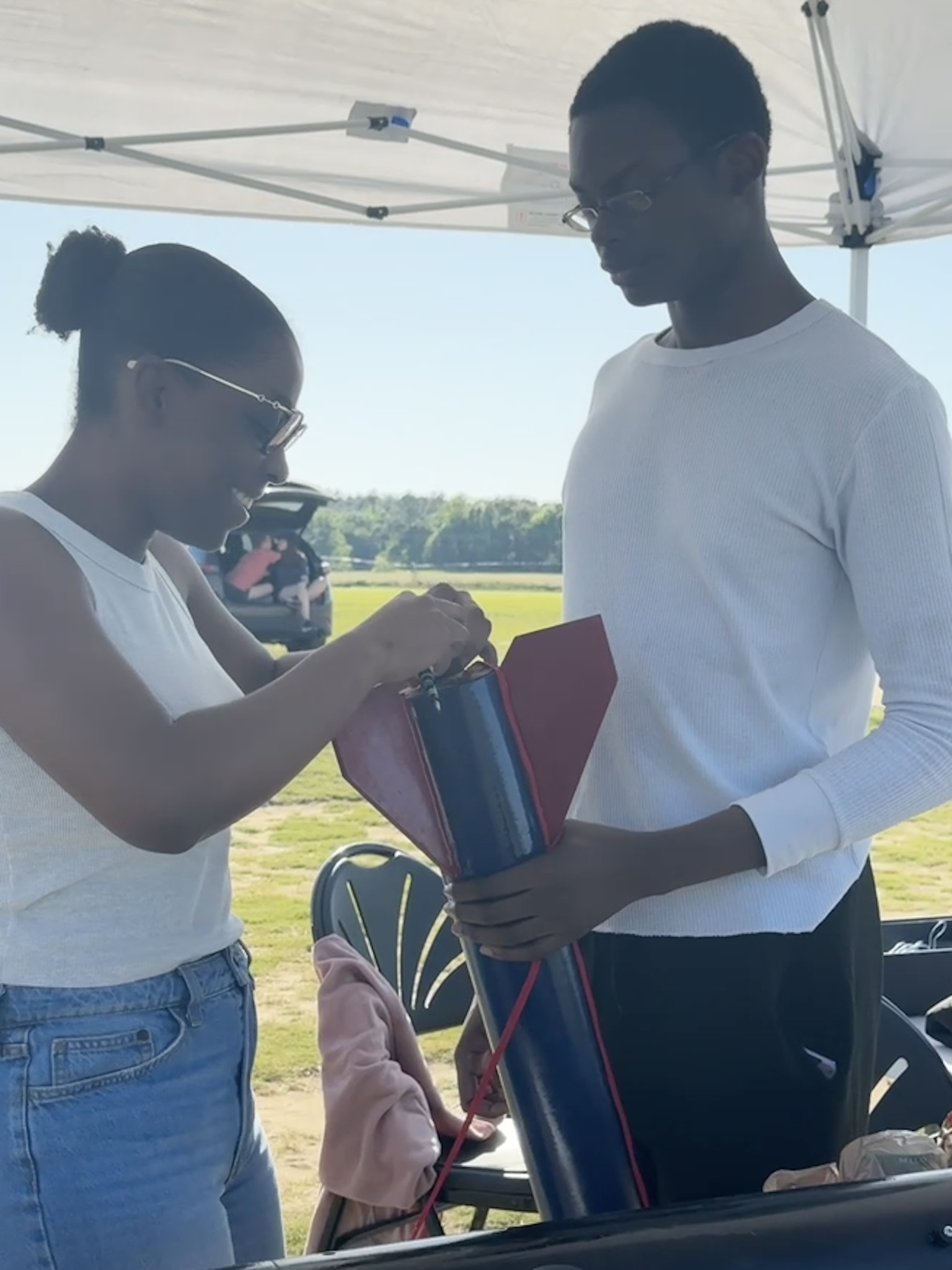 Joy President Camelia Ingram and member Nicholas have a laugh as the prep Gen. James